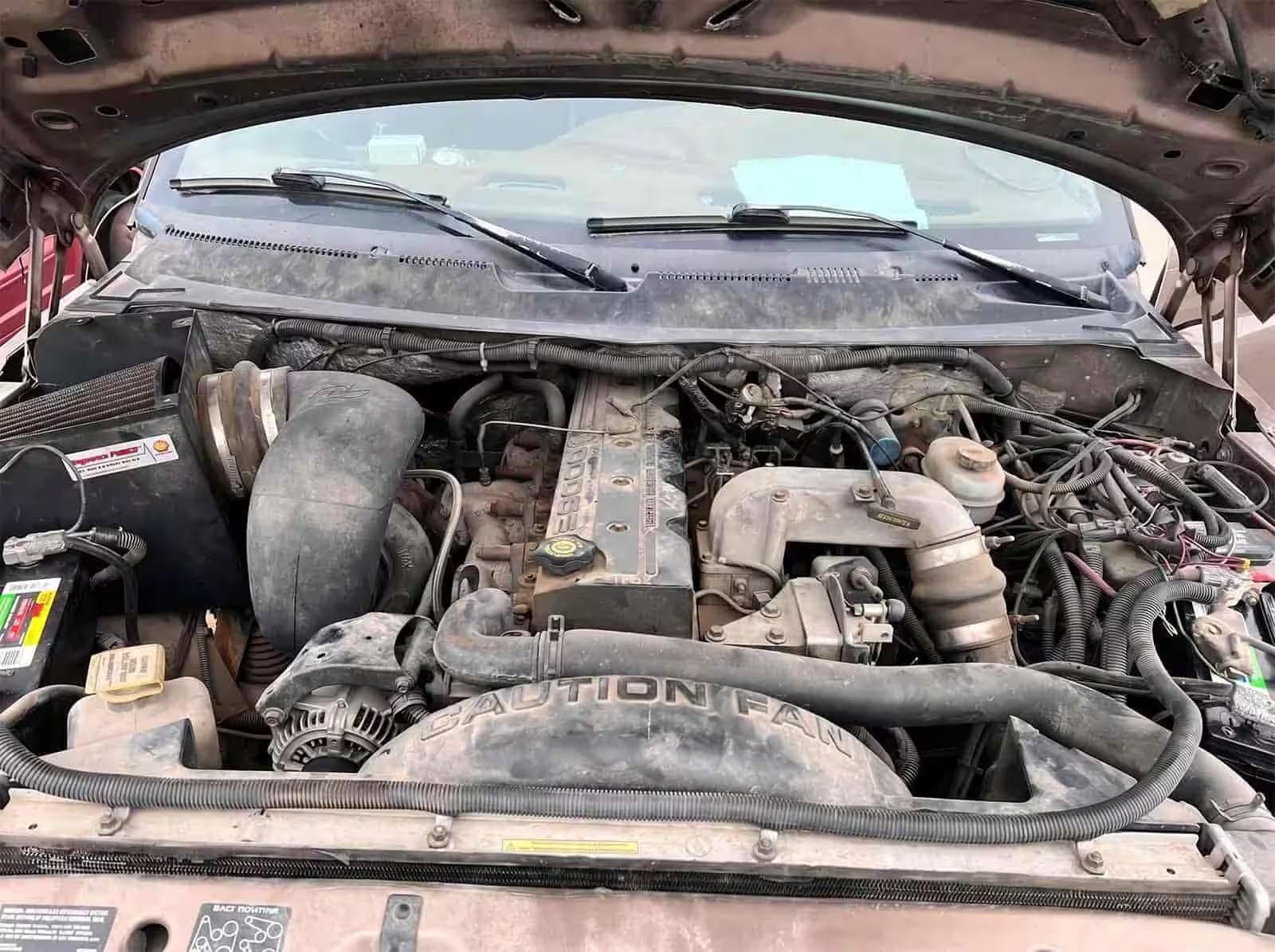 Engine bay — before vs after (before)