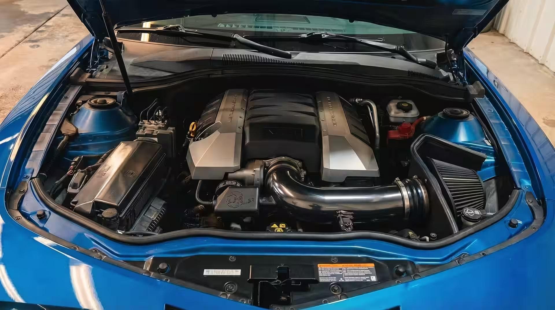 Mustang engine bay — before vs after (after)