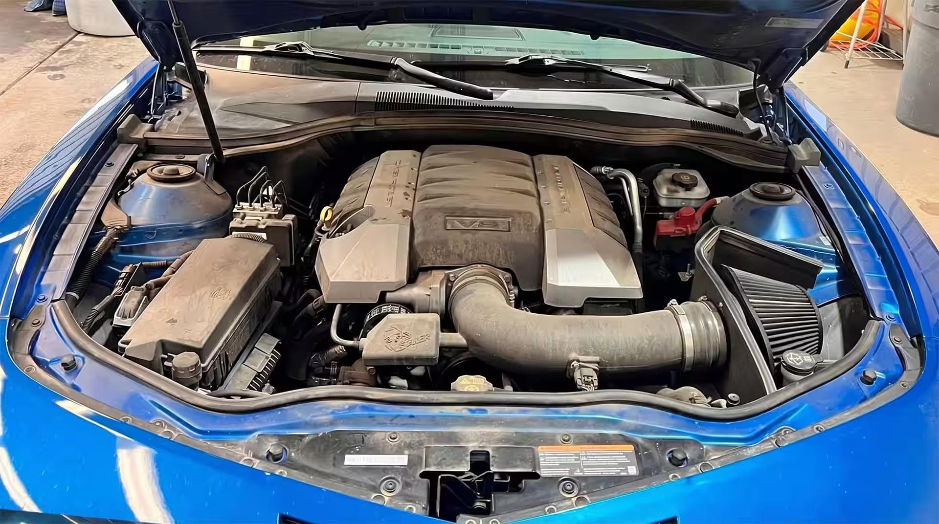 Mustang engine bay — before vs after (before)